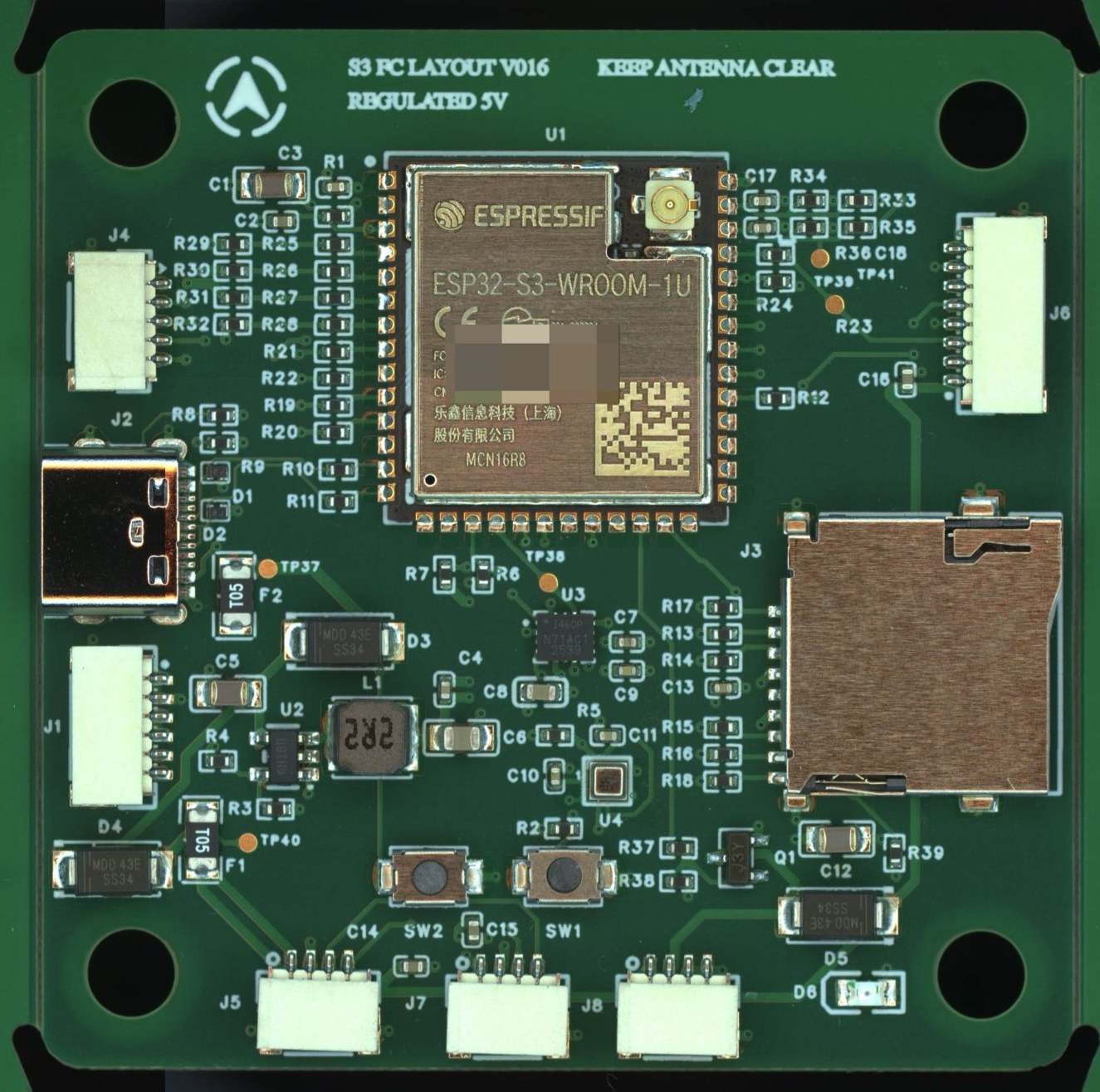 PX4 飞控实物：绿色电路板中央是 ESP32-S3 模组，周围是接插件、SD 卡槽和电源器件